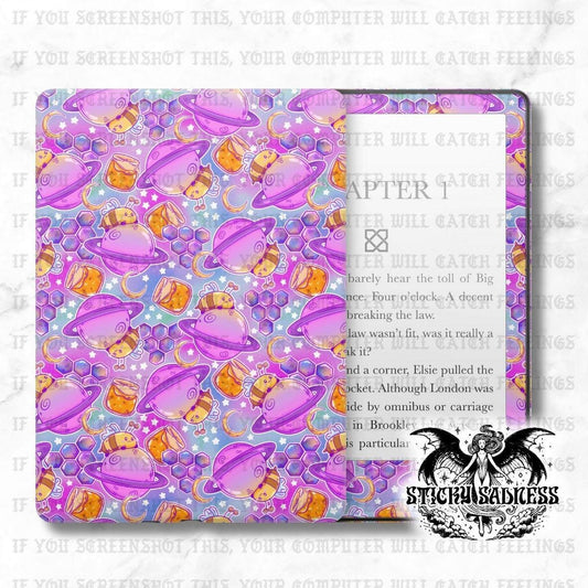 The image is a vibrant and colorful book cover with a repeating pattern of purple and orange shapes, including planets, flowers, and other celestial elements. The cover appears to be a book cover for a book titled &quot;CHAPTER 1&quot; and is designed to be visually appealing and engaging.