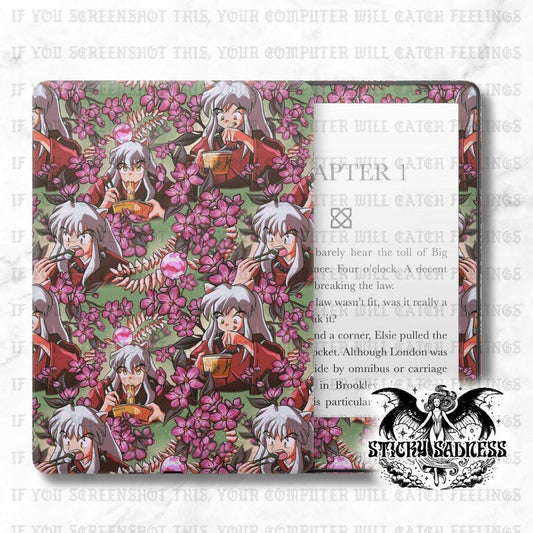The image is a collage of multiple images featuring characters from the anime series Inuyasha. The collage includes various scenes and characters from the show, such as Inuyasha, a young girl with long gray hair, and other characters from the series. The collage is set against a background of pink flowers, creating a visually appealing and colorful composition.
